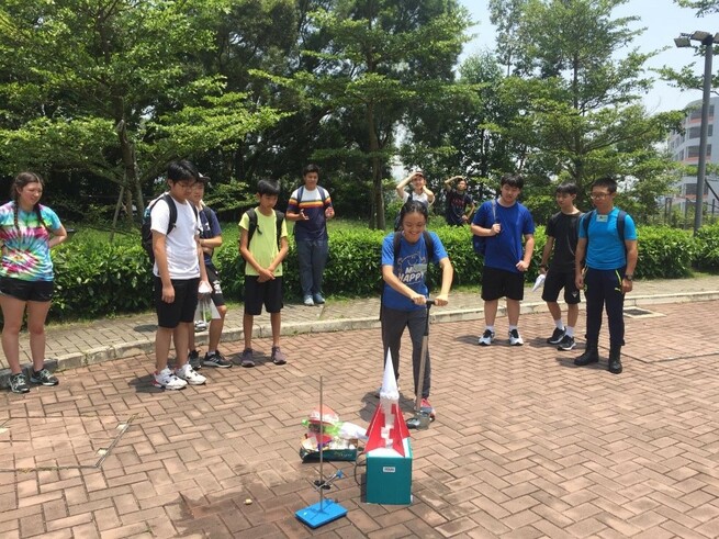 A group of students were preparing to launch the water rockets designed and built by themselves
